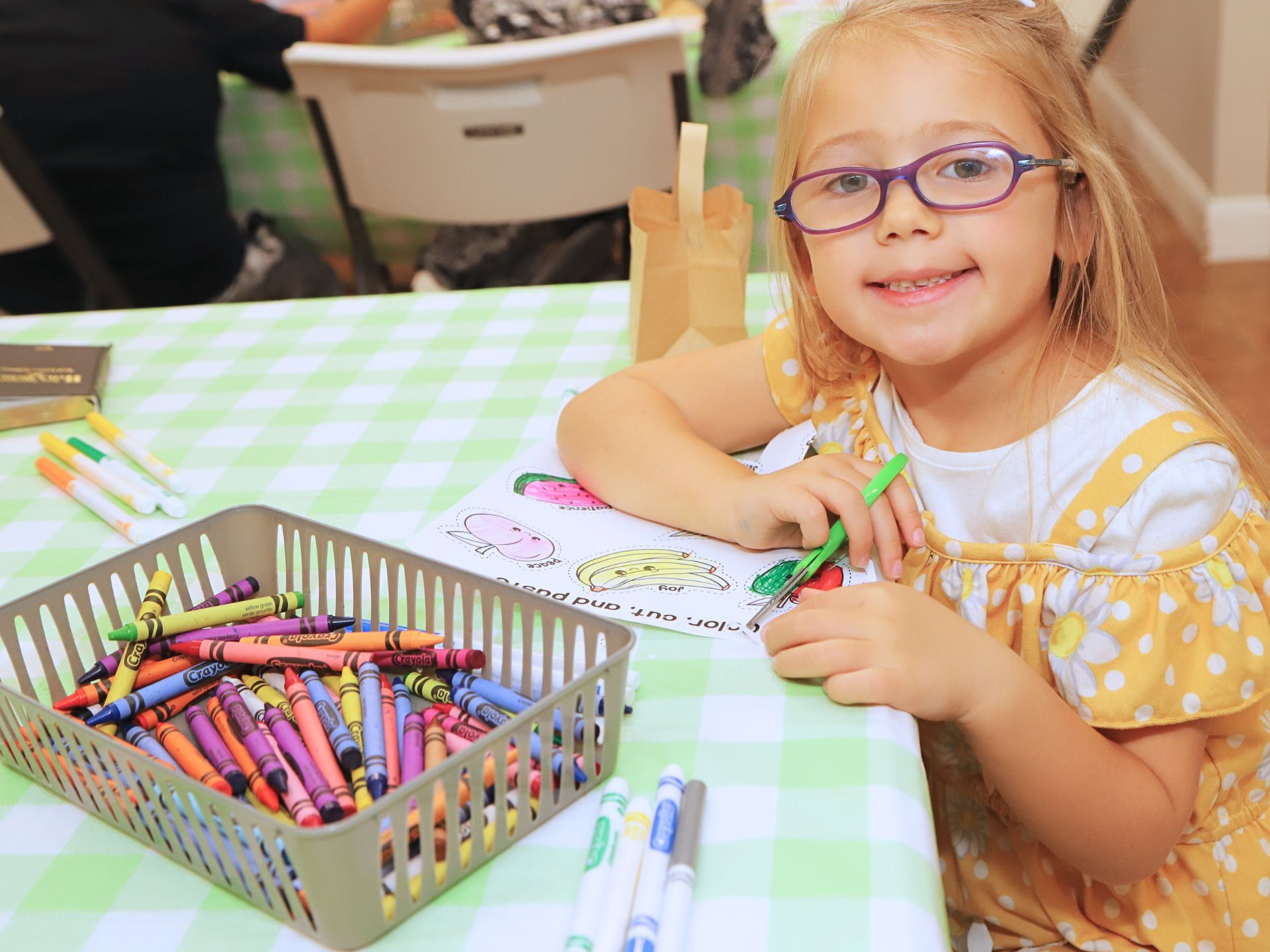 A child working on a craft in Tampa Kids