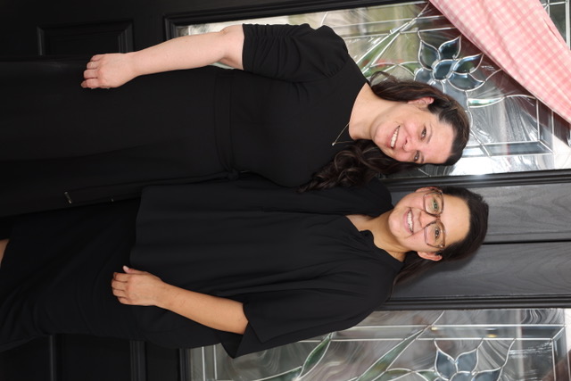 Two members of Tampa Pentecostal Church smiling together